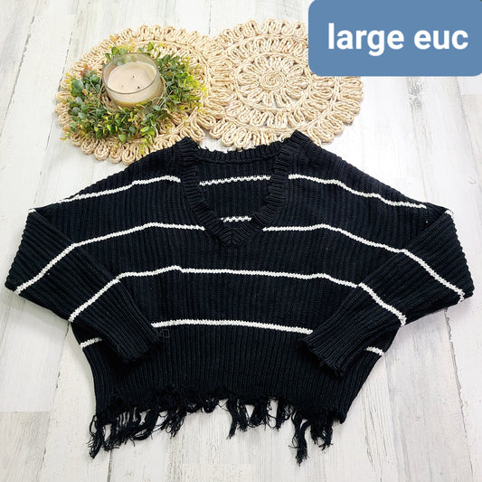 large distressed black sweater