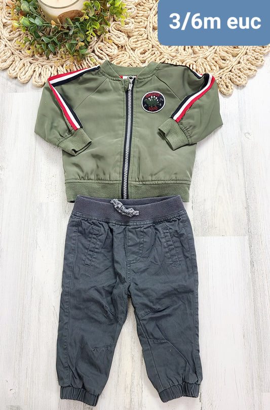 green jacket and gray joggers