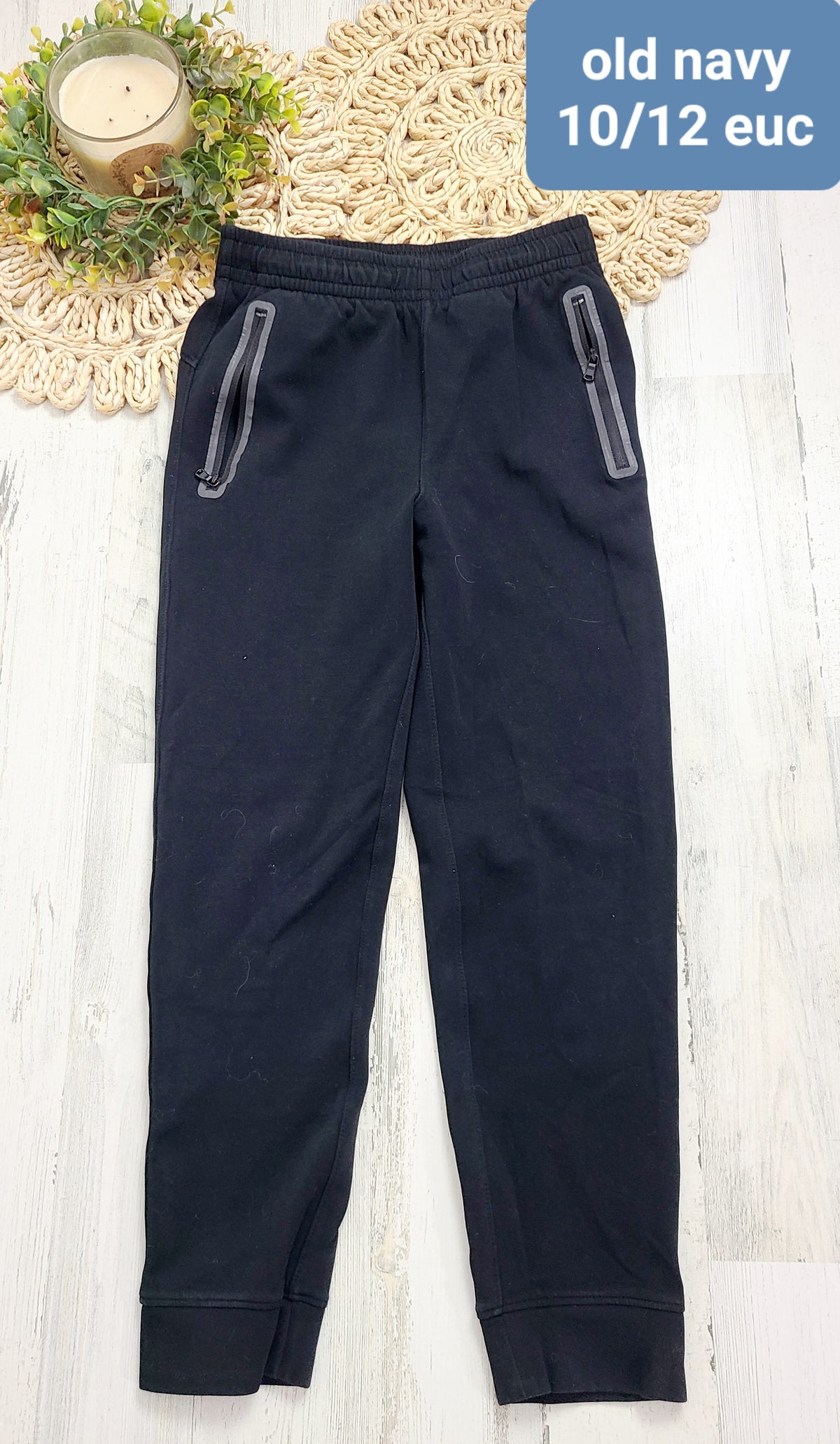 black joggers with gray zip pockets