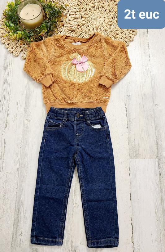 furry pumpkin top and jeans